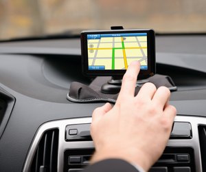 Man Using Gps Navigation While Driving