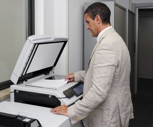 Businessman doing a photocopy