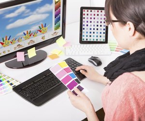 Graphic designer at work. Color samples.