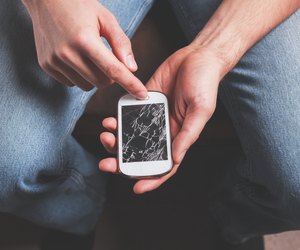 Man with broken smart phone
