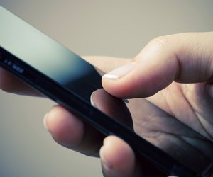 Woman hand holding a phone