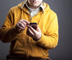 Man using smartphone torso