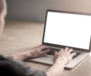 Man using laptop computer.