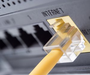 Yellow network cable connecting to the internet slot