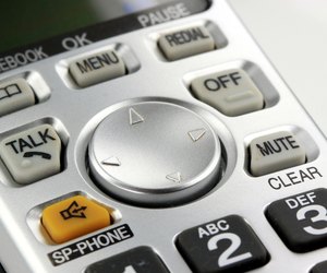 Silver cordless phone keypad closeup
