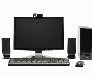 Computer with mouse, speakers and webcam