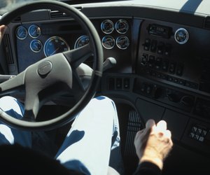 Interior view of man driving truck