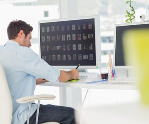 Rear view of a photo editor working