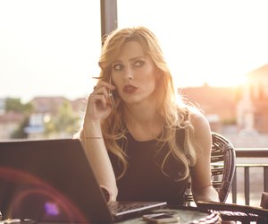 Serious business woman at sunset