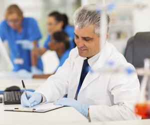 middle aged medical researcher working in lab
