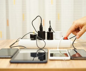 man is turning off power adapters for mobile phones