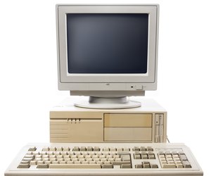 Old computer, keyboard CPU and monitor isolated on white