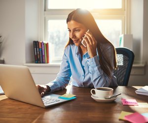Woman working on laptop at office