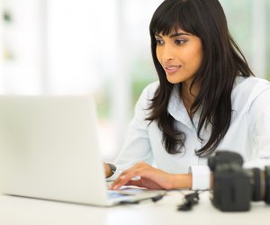 female photographer working on computer