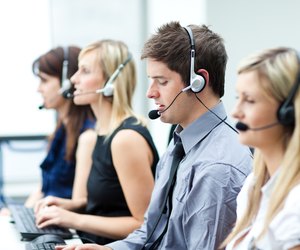 Attractive young man working in a call center