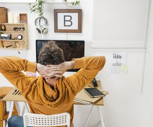 Modern creative man relaxing on workspace.