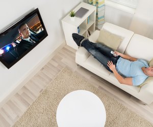 Man Watching Movie On Television In Living Room