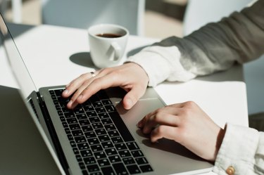 Businessman working laptop for new architectural project. Generic design notebook on the table. Young businessman working with laptop at office. Unrecognizable man using a modern portable computer