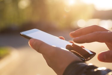 Man using his Mobile Phone outdoor