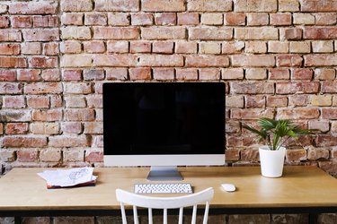 Workspace at brick wall in office