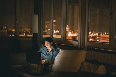 Woman using laptop at home