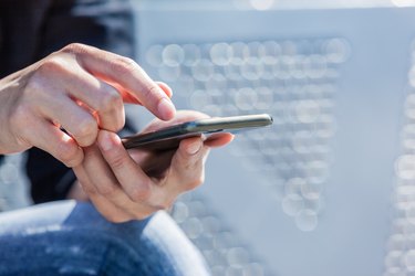 Hands of Woman Using Smart Phone