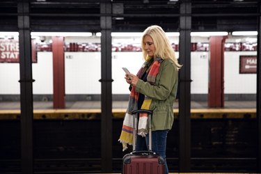 Woman in waiting for the train in the city