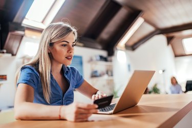 Close-up image of beautiful blonde woman shopping online.