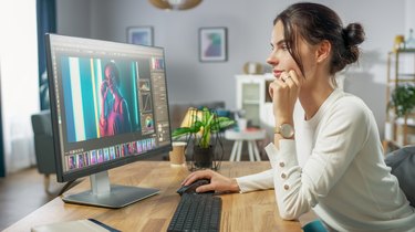 Professional Female Photographer Works in Photo Editing App / Software on His Personal Computer. Photo Editor Retouching Photos of Beautiful Girl. Mock-up Software Design.