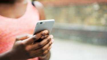 Close up of woman using smart phone