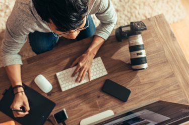 Photographer editing pictures after shoot