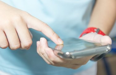 Close up of A man using mobile smart phone.