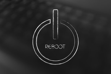 reboot symbol on laptop bokeh background