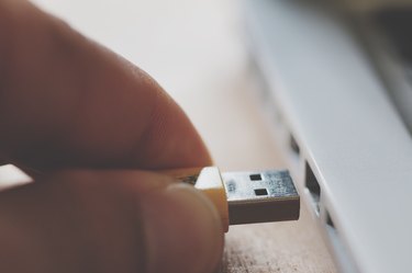 Close-Up Of Hand Using Cable