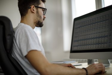 Young man working in his office