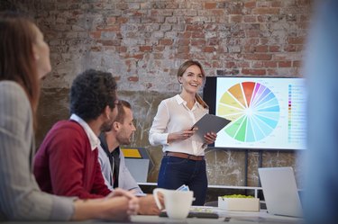 Businesswoman holding presentation at a meeting with colleagues in the office