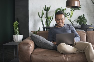 Young Asian man working at home.