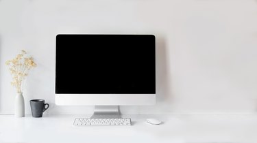 Modern clean workspace mockup with blank screen desktop computer.