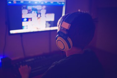 Little boy with headset using computer