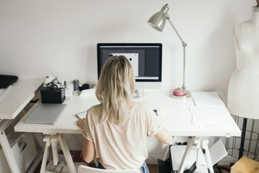 High angle view of female design professional using computer at home