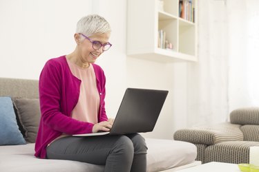 Senior woman using laptop