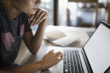 Young woman working at laptop