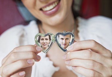 woman showing her boyfriend in locket