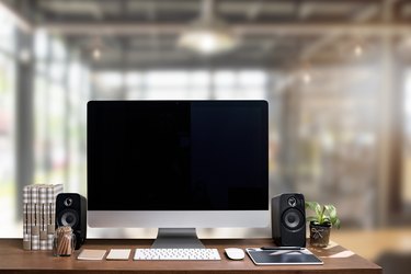 Workspace mockup with desktop computer with black screen