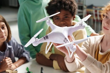 Quadcopter in Hands of Girl