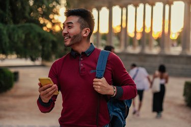 Asian tourist navigating with smartphone