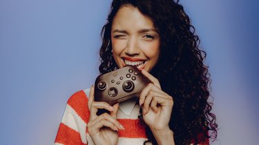 woman holding chocolate xbox controller