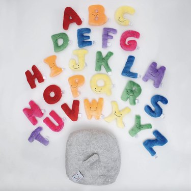 Rainbow plush letters and gray bag