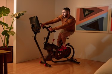 man riding bowflex bike