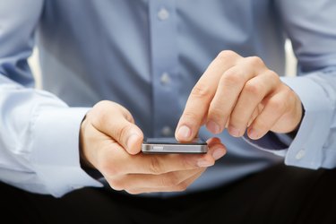 Close up of a man using smart phone